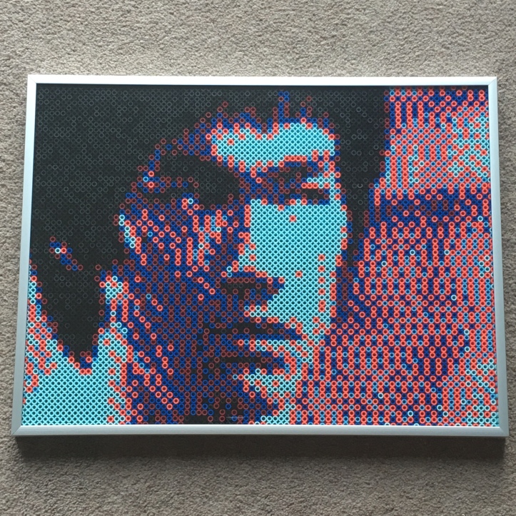 Pixel art portrait of Bruce Lee